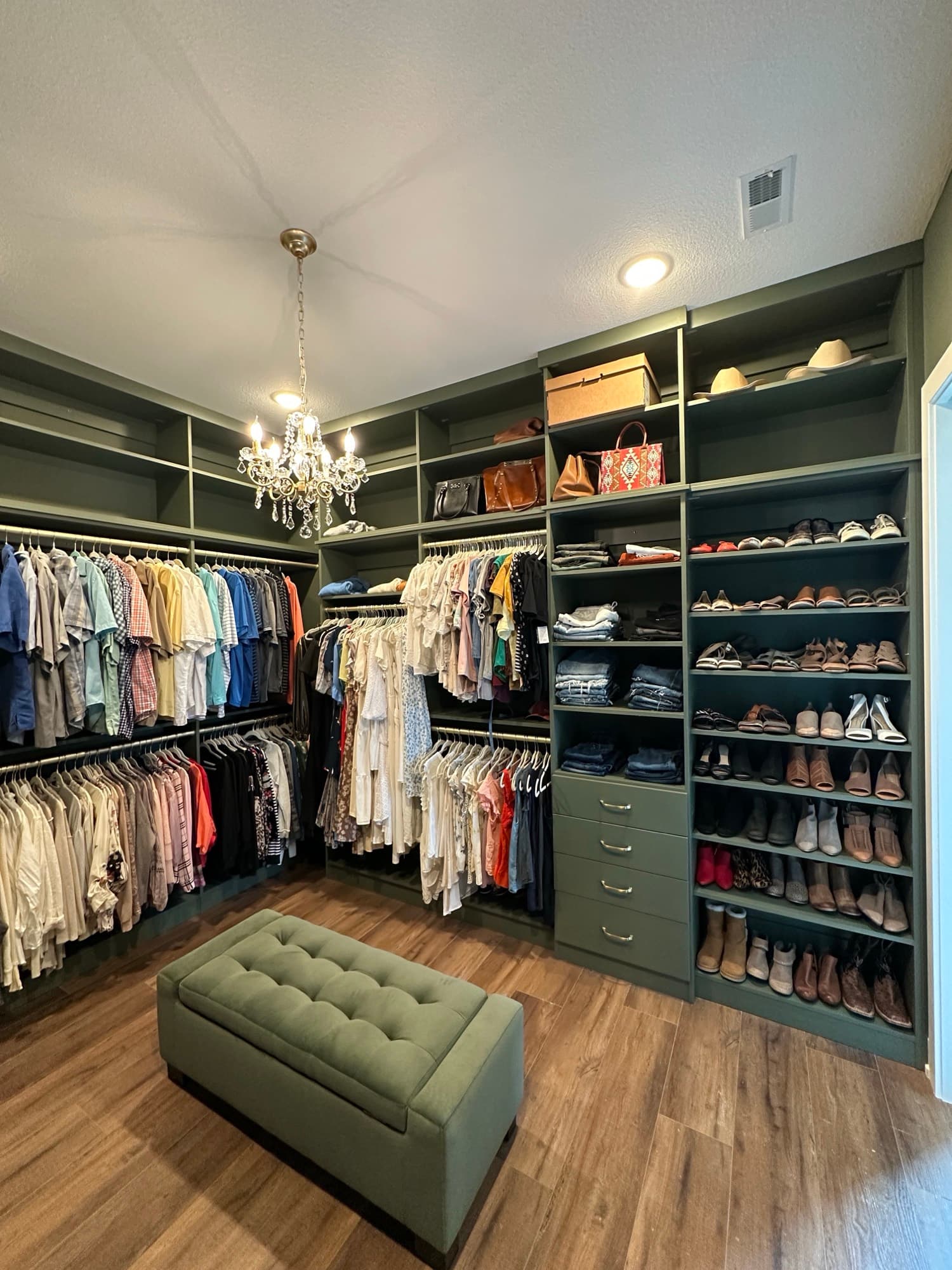 Walk-in closet with walnut island in Sedalia, MO