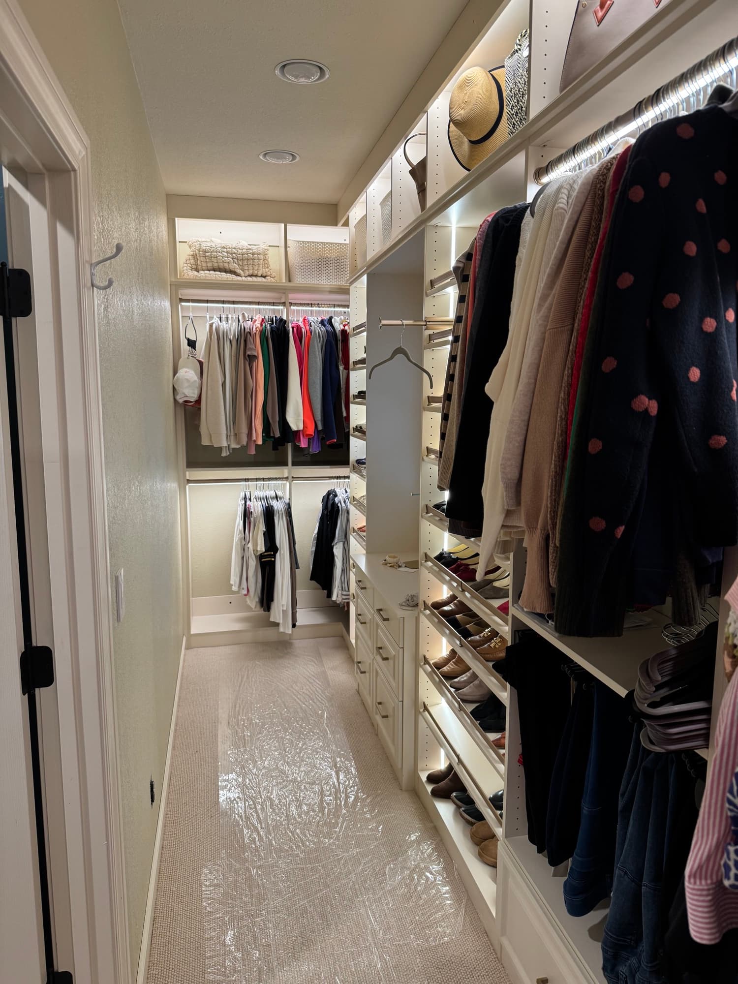 Walk-in closet with brass hardware
